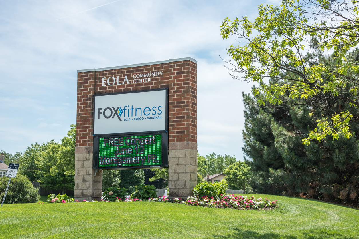 Aurora, Il,United StatesApril 19,2014: Eola Community Center brick sign with Led display under a blue sky with clouds in Illinois